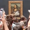 Ataque a la Mona Lisa hombre logra acercarse en silla de ruedas