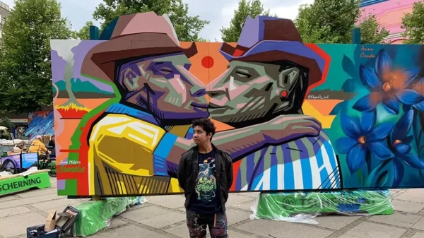 Artista pinta beso entre hombres aficionados de Tigres y Monterrey